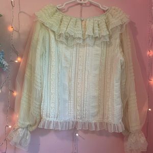 Cream blouse With decorative sleeves frills and lace and collar